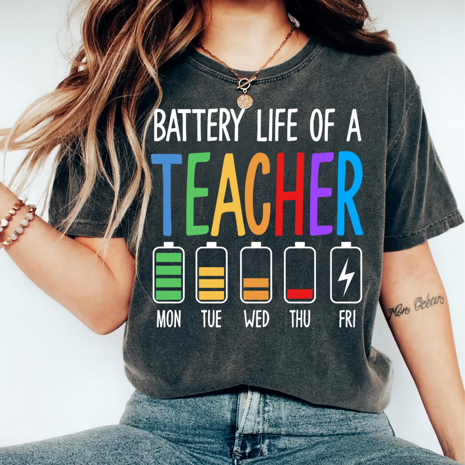 Battery life of a teacher graphic printed on shirt mockup with colorful teacher typography and weekly battery icons