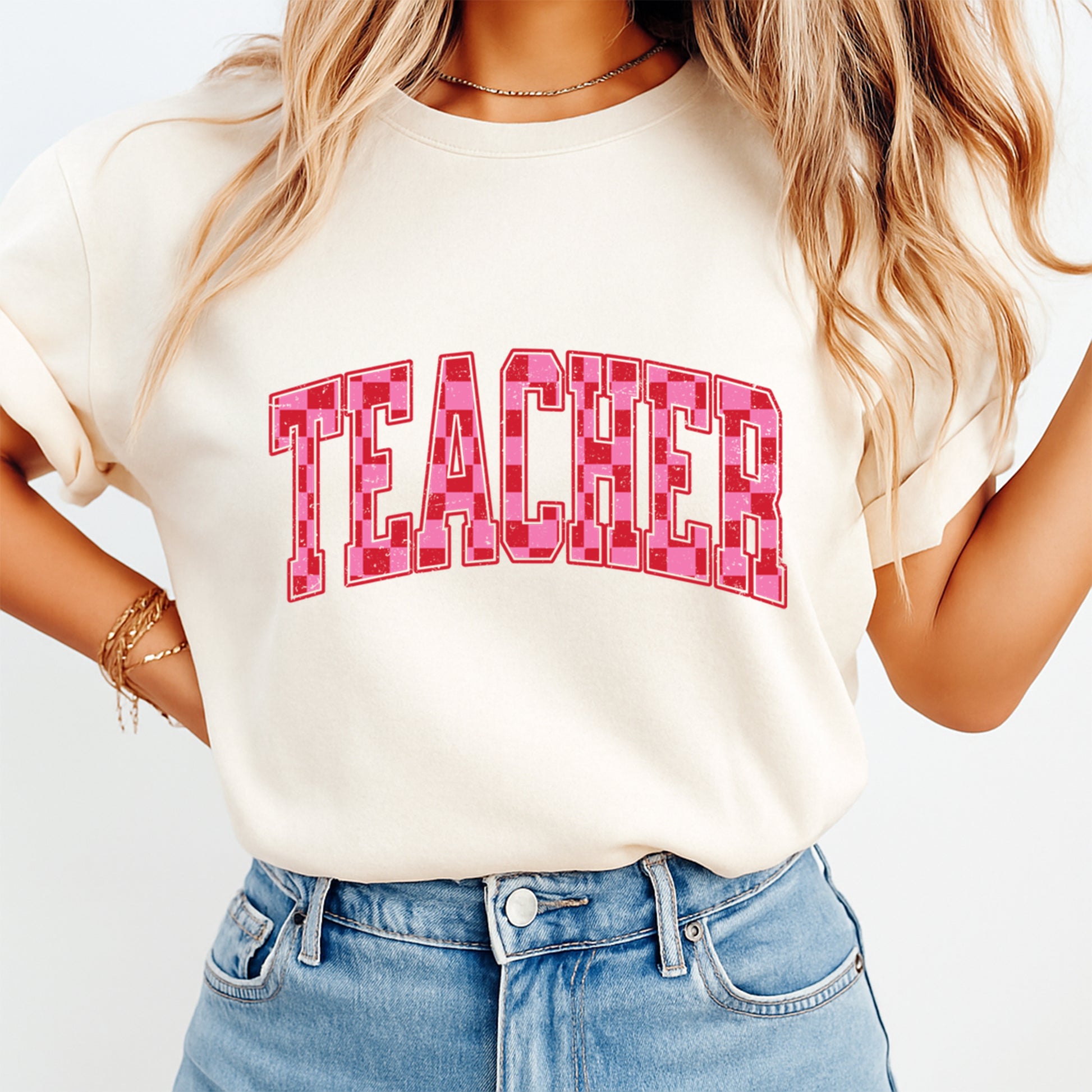 Teacher pink varsity graphic printed on cream t shirt showing finished heat transfer apparel example