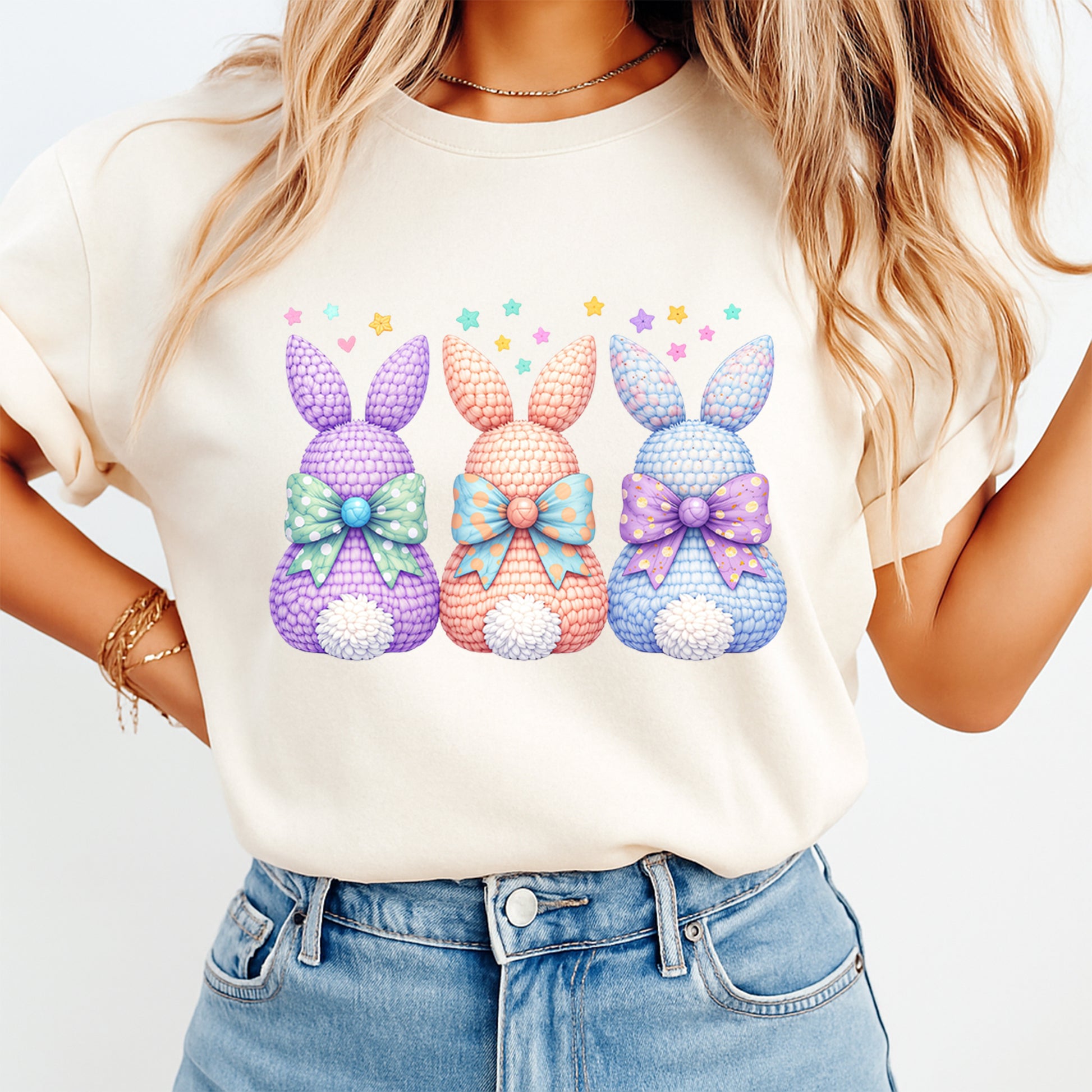 Three pastel bunny silhouettes with bows printed on cream shirt for Easter outfit