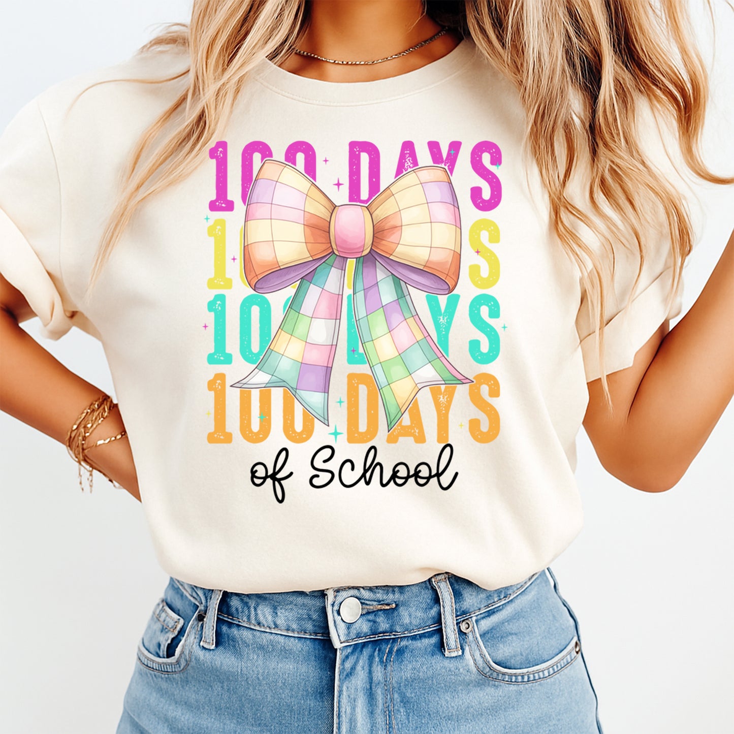 100 days of school pastel bow graphic printed on cream shirt for classroom celebration outfit