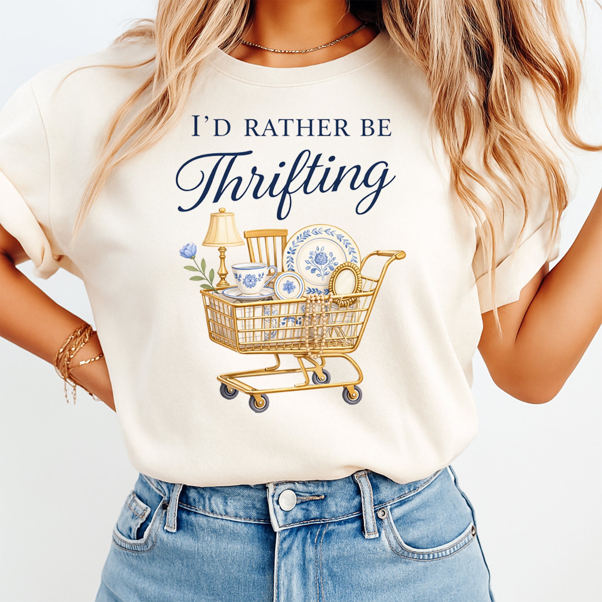 Person wearing a t-shirt with 'I'd Rather Be Thrifting' graphic and text.