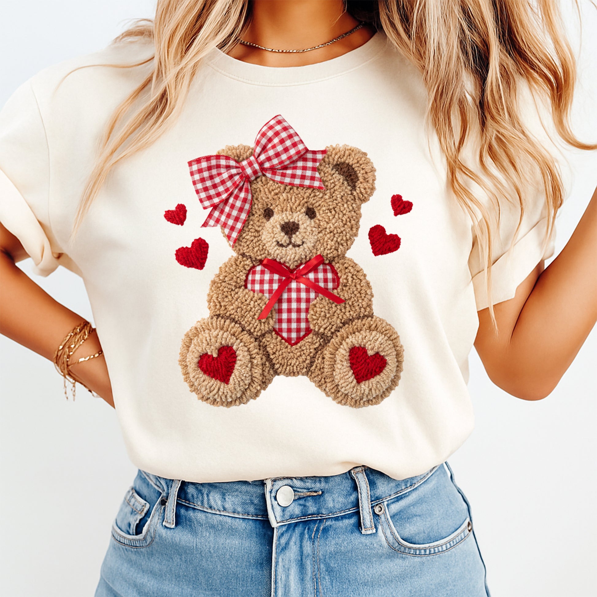 woman wearing crochet teddy bear with red bow and heart graphic valentines shirt ready to press dtf transfer design