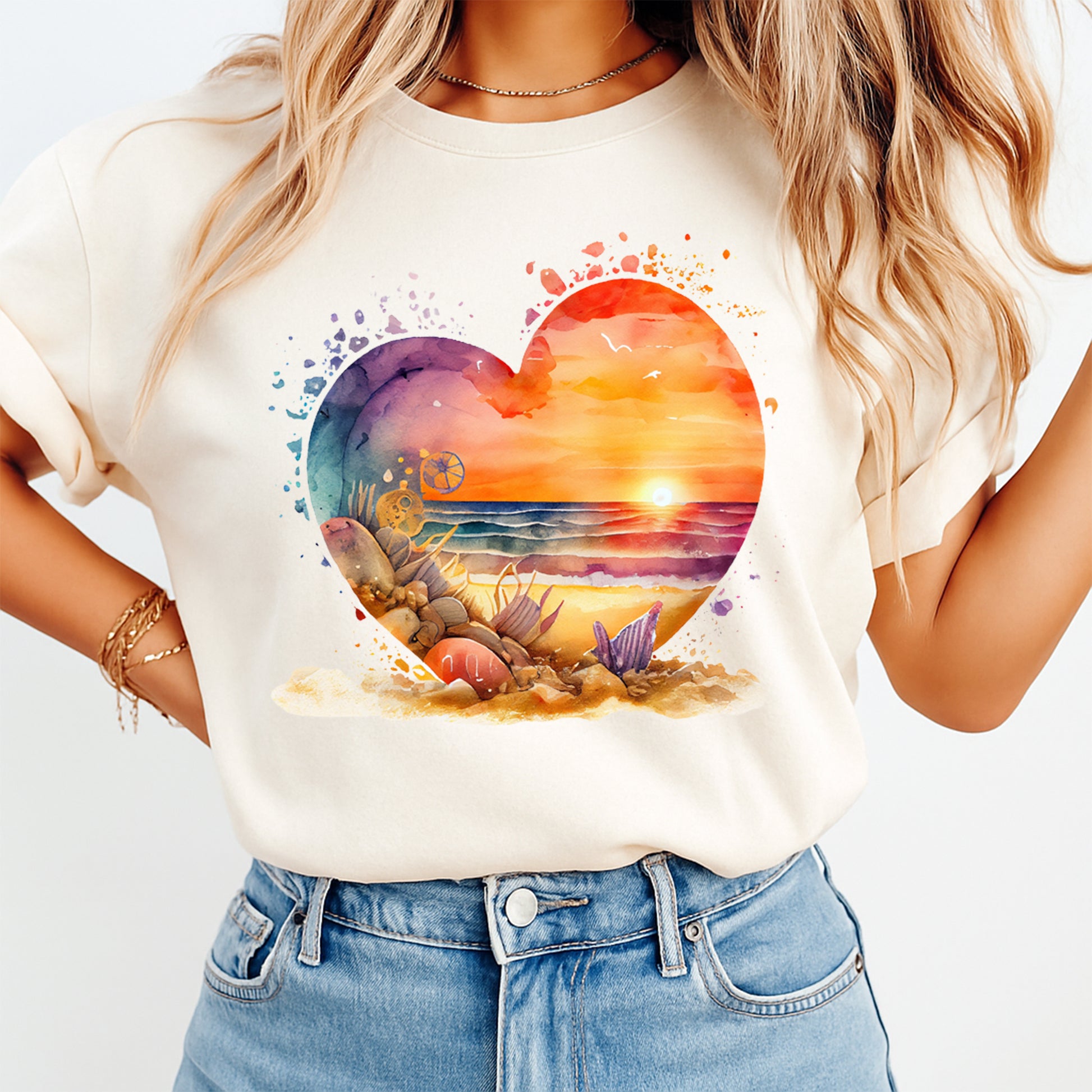 woman wearing shirt with watercolor ocean sunset heart seashell beach design ready to press dtf transfer applied