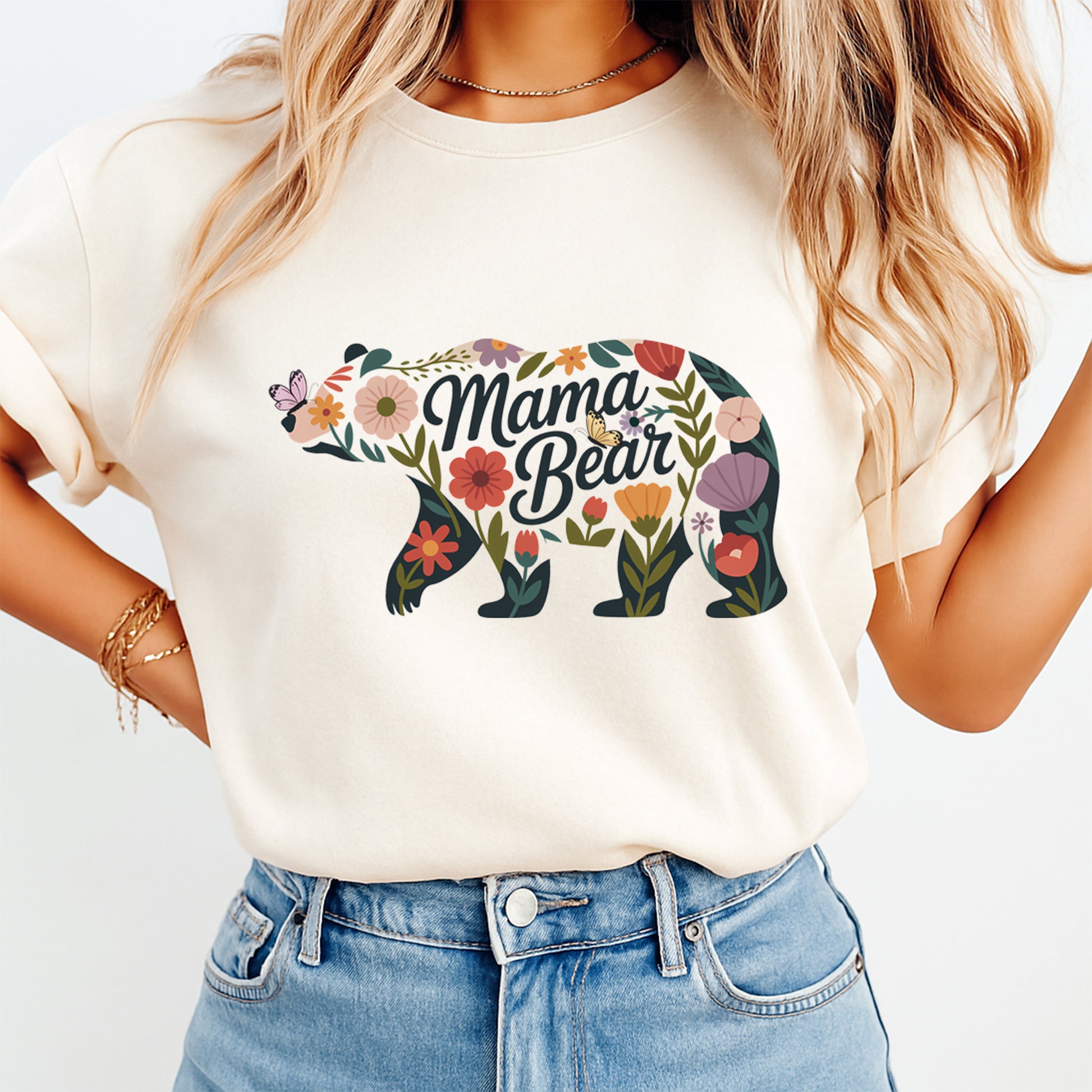 woman wearing shirt with floral mama bear design ready to press dtf transfer applied