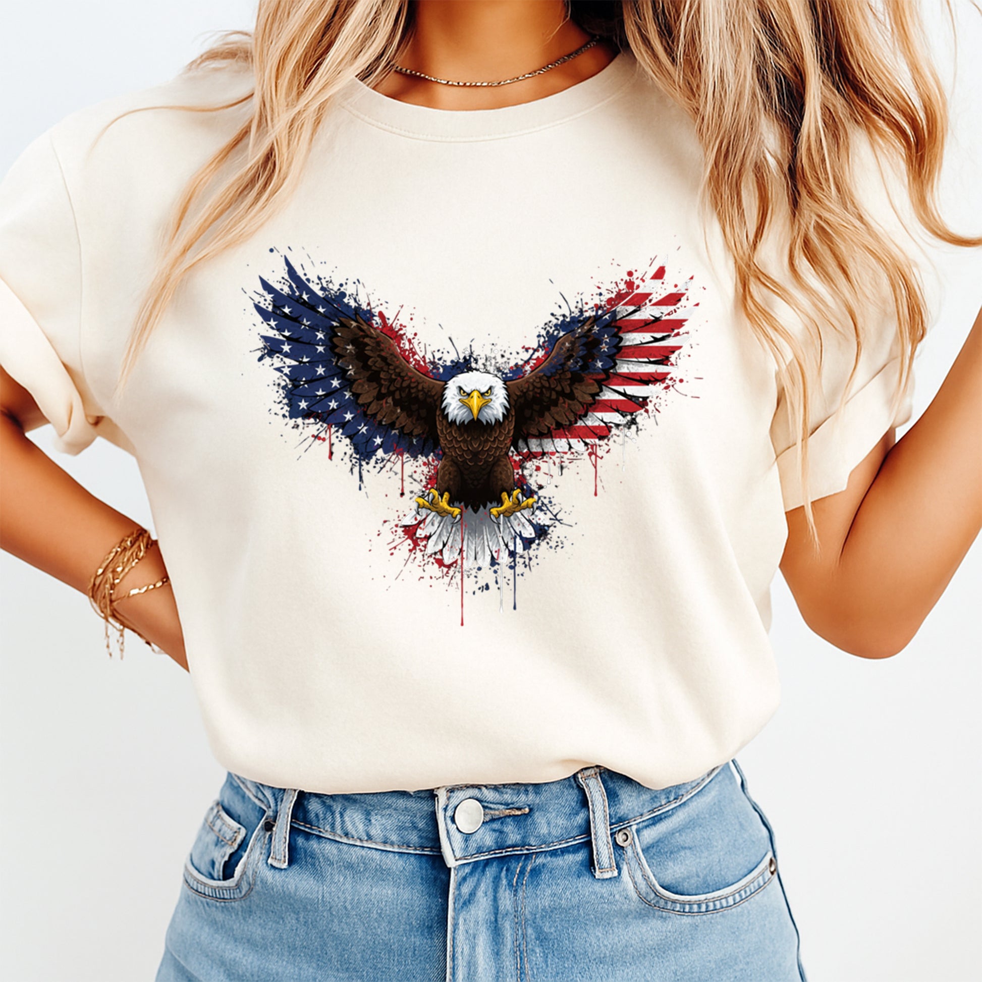woman wearing beige shirt with patriotic eagle dtf transfer featuring american flag wings and bold splatter design