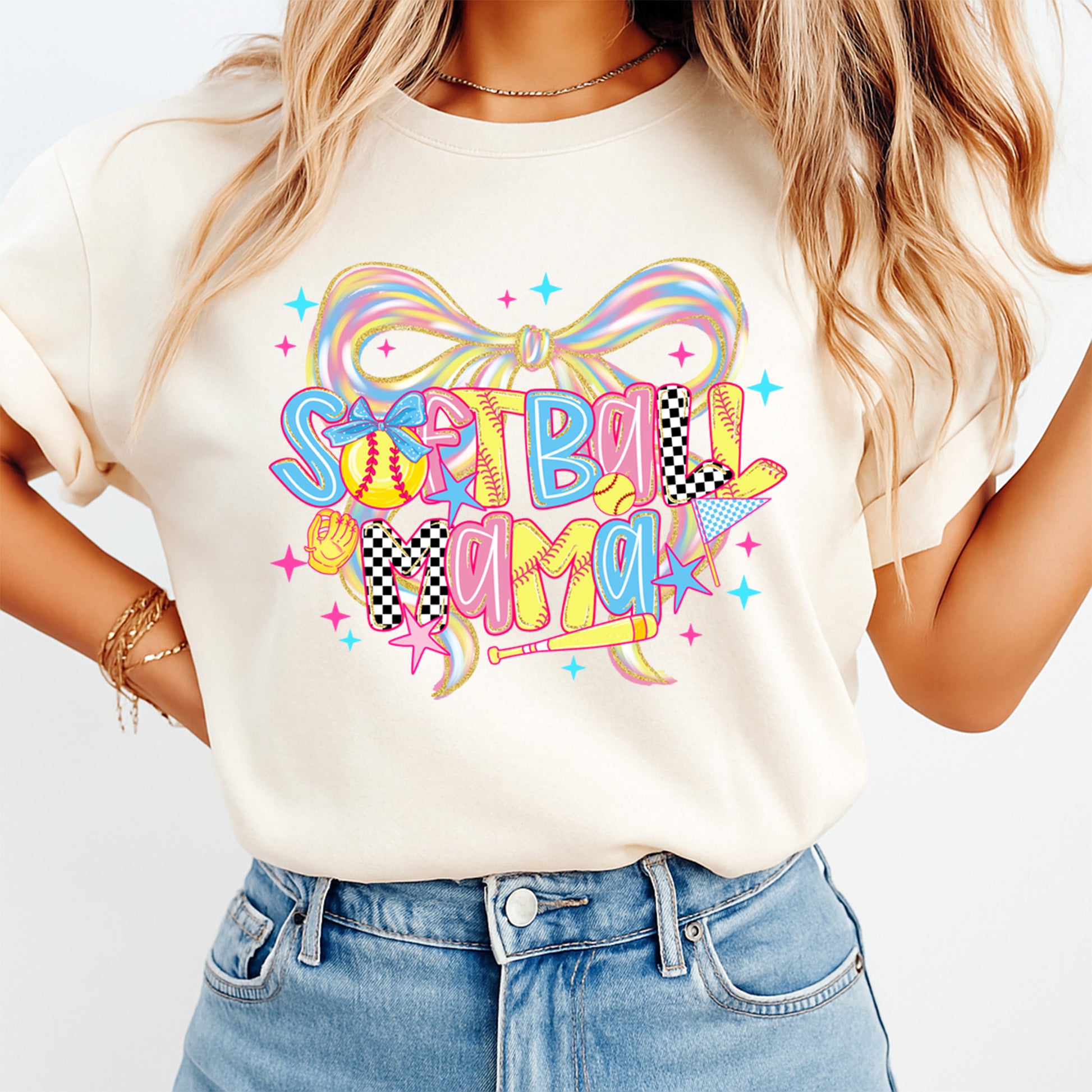 woman wearing beige shirt with softball mama dtf transfer featuring colorful lettering bow and softball themed graphics