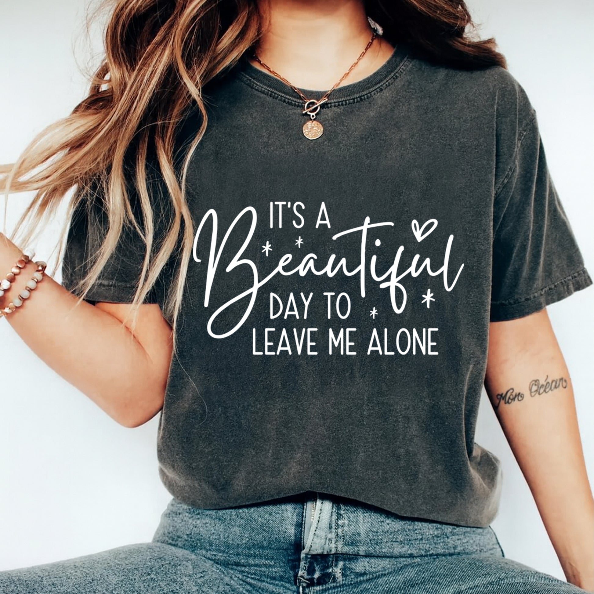 woman wearing dark t shirt with sarcastic quote dtf transfer saying its a beautiful day to leave me alone