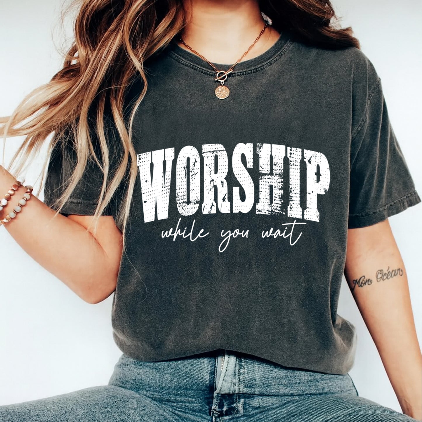 woman wearing worship while you wait shirt distressed faith graphic tee ready to press dtf transfer