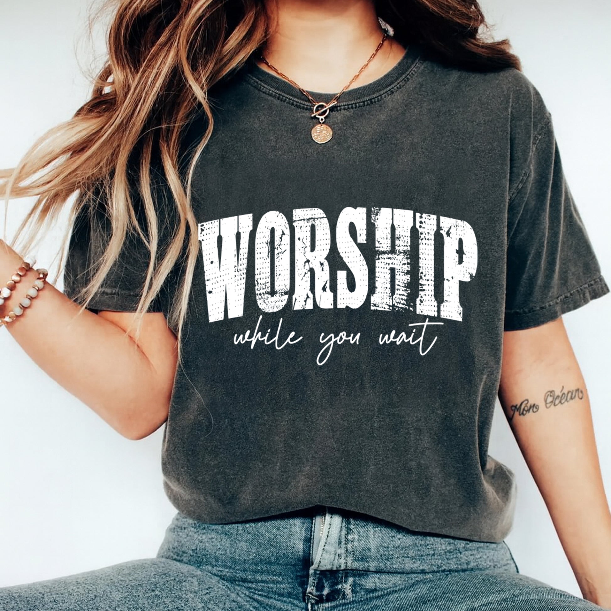 woman wearing worship while you wait shirt distressed faith graphic tee ready to press dtf transfer