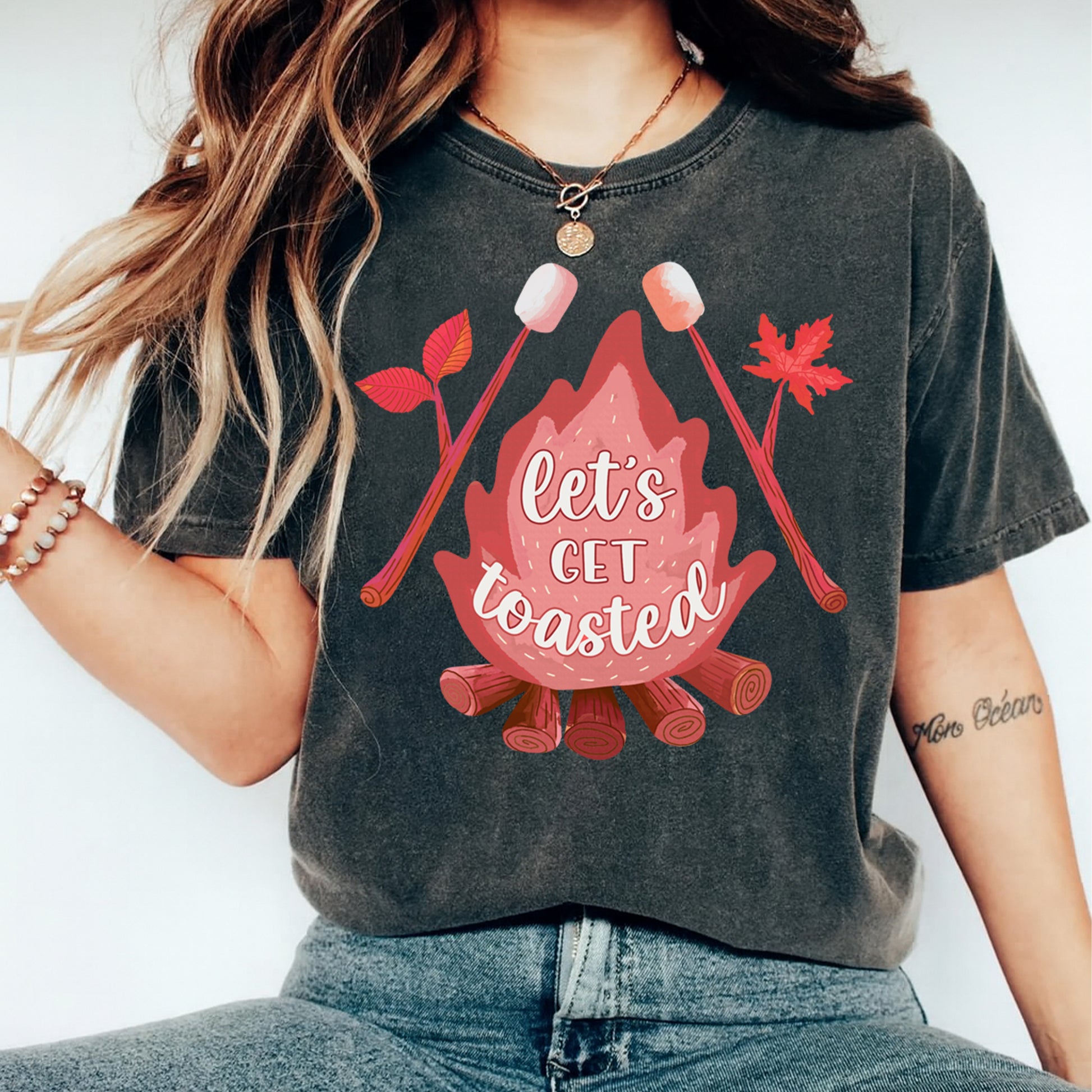 woman wearing fall campfire graphic shirt with marshmallows and lets get toasted text ready to press dtf transfer