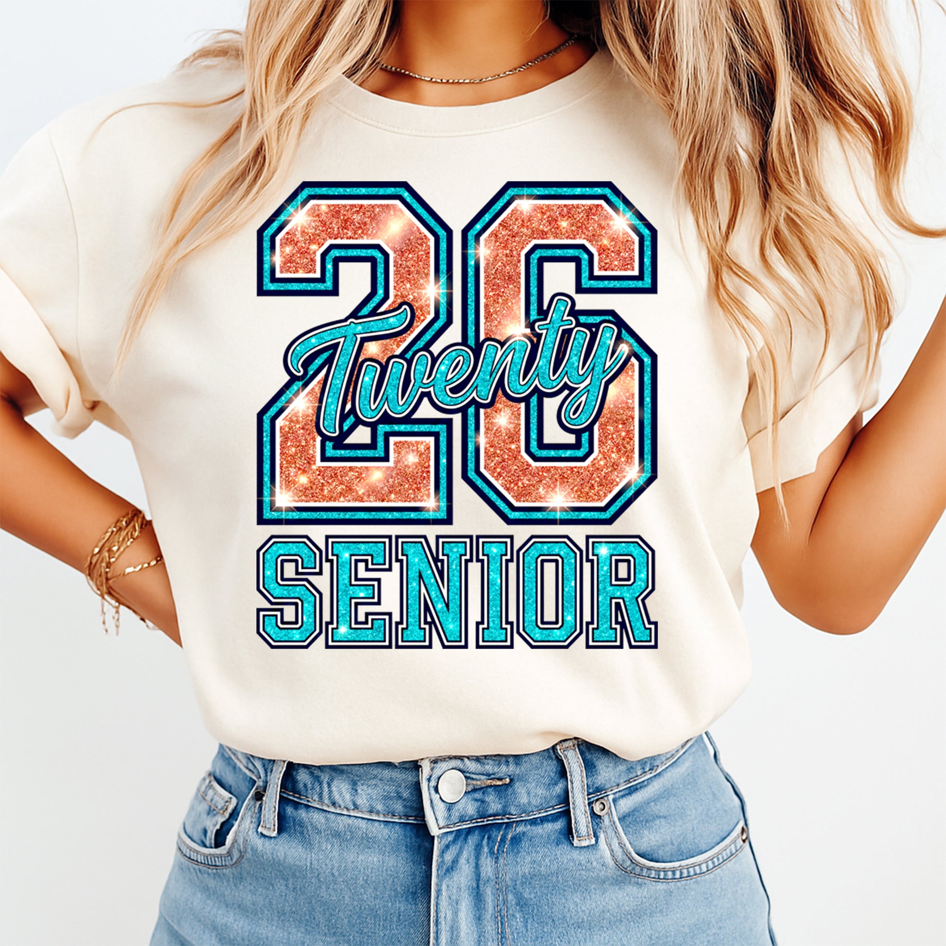 Woman wearing a cream shirt with 26 twenty senior glitter style ready to press dtf graphic in varsity lettering for graduation