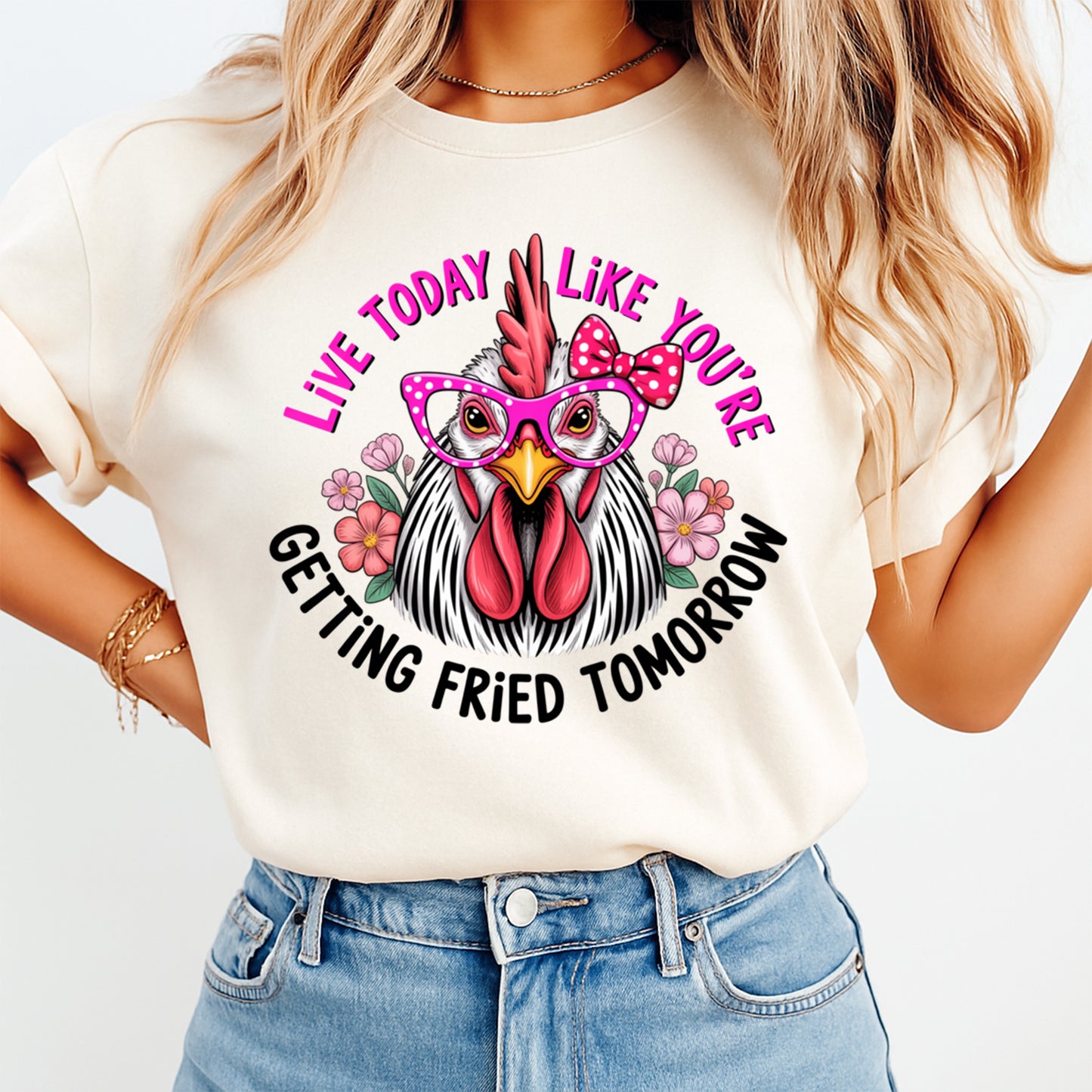 Woman wearing a cream shirt with live today like youre getting fried tomorrow ready to press dtf graphic featuring a chicken in pink glasses and bow