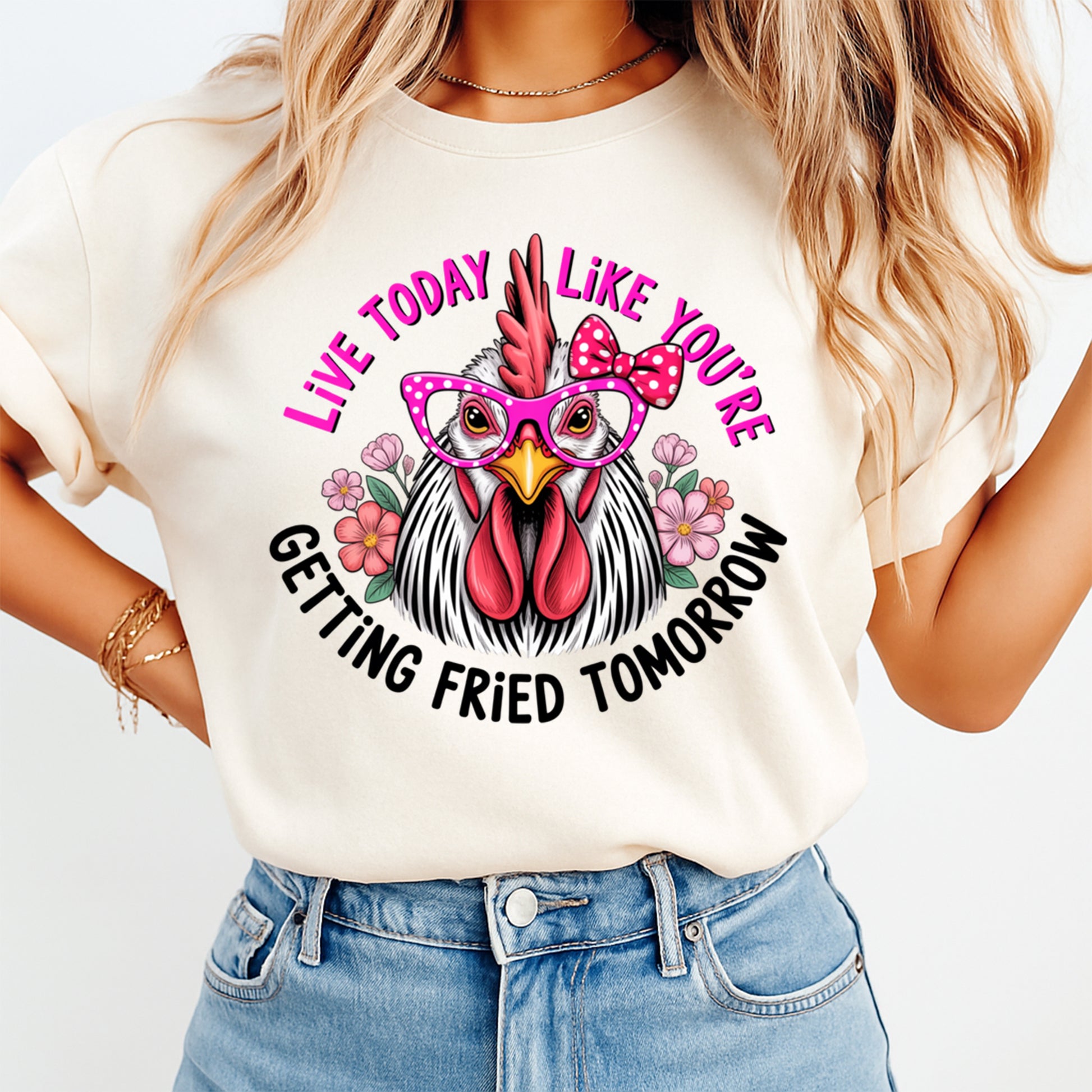 Woman wearing a cream shirt with live today like youre getting fried tomorrow ready to press dtf graphic featuring a chicken in pink glasses and bow