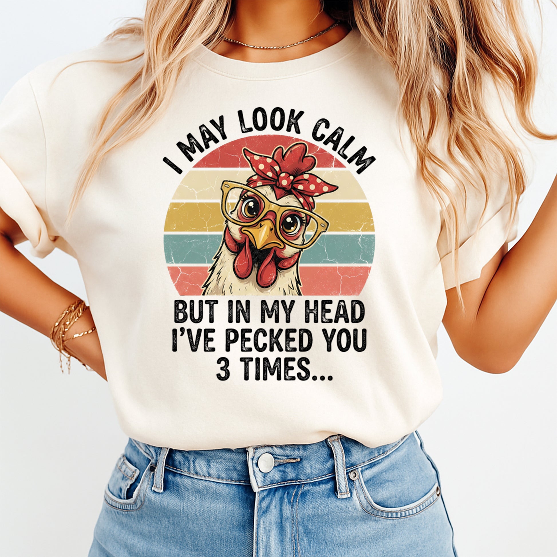 Woman wearing a cream shirt with funny chicken ready to press dtf graphic featuring glasses bow and retro stripes with sarcastic quote