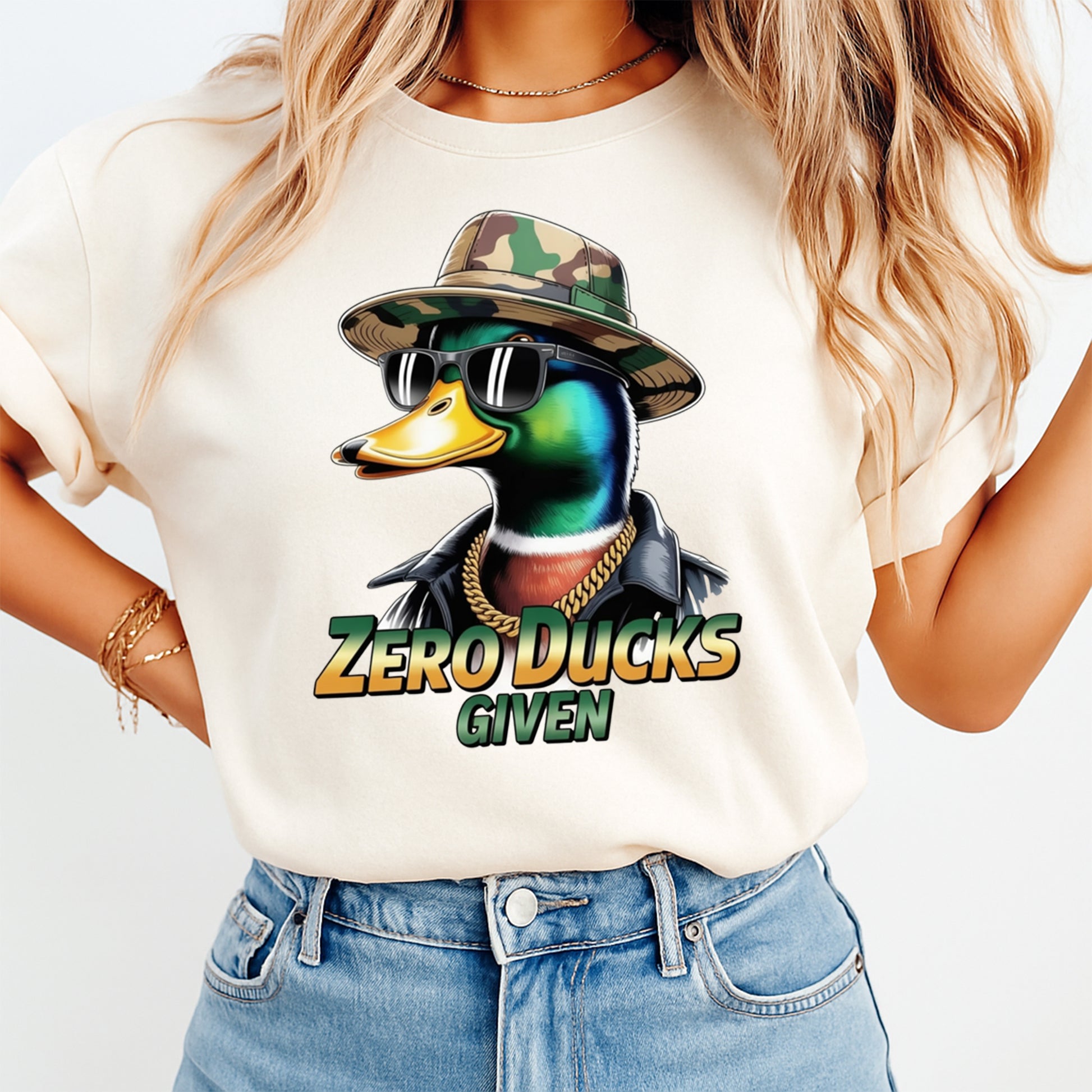 Woman wearing a cream shirt with a funny mallard duck ready to press dtf graphic and Zero Ducks Given phrase