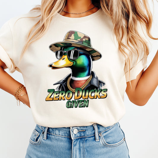 Woman wearing a cream shirt with a funny mallard duck ready to press dtf graphic and Zero Ducks Given phrase