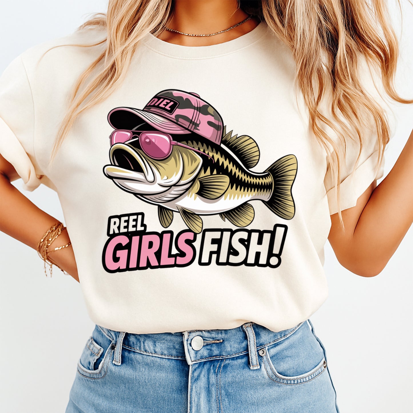 Woman wearing a cream shirt with a funny fishing ready to press dtf graphic featuring bass fish pink sunglasses and Reel Girls Fish text