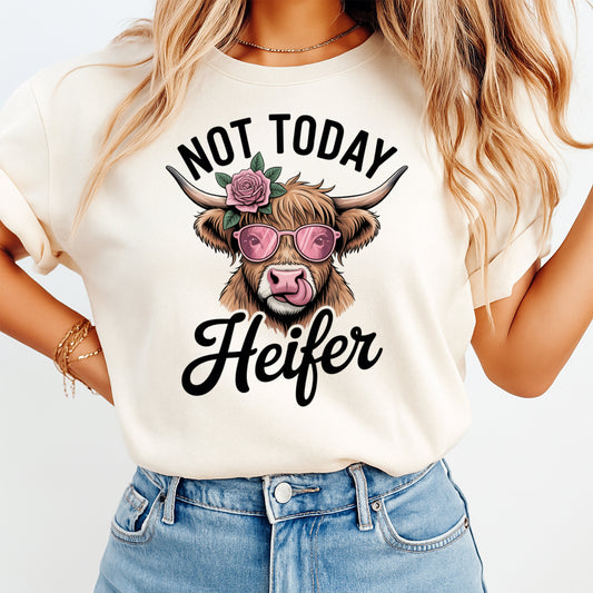 Woman wearing a cream shirt with a funny cow ready to press dtf graphic featuring pink sunglasses flower and Not Today Heifer text