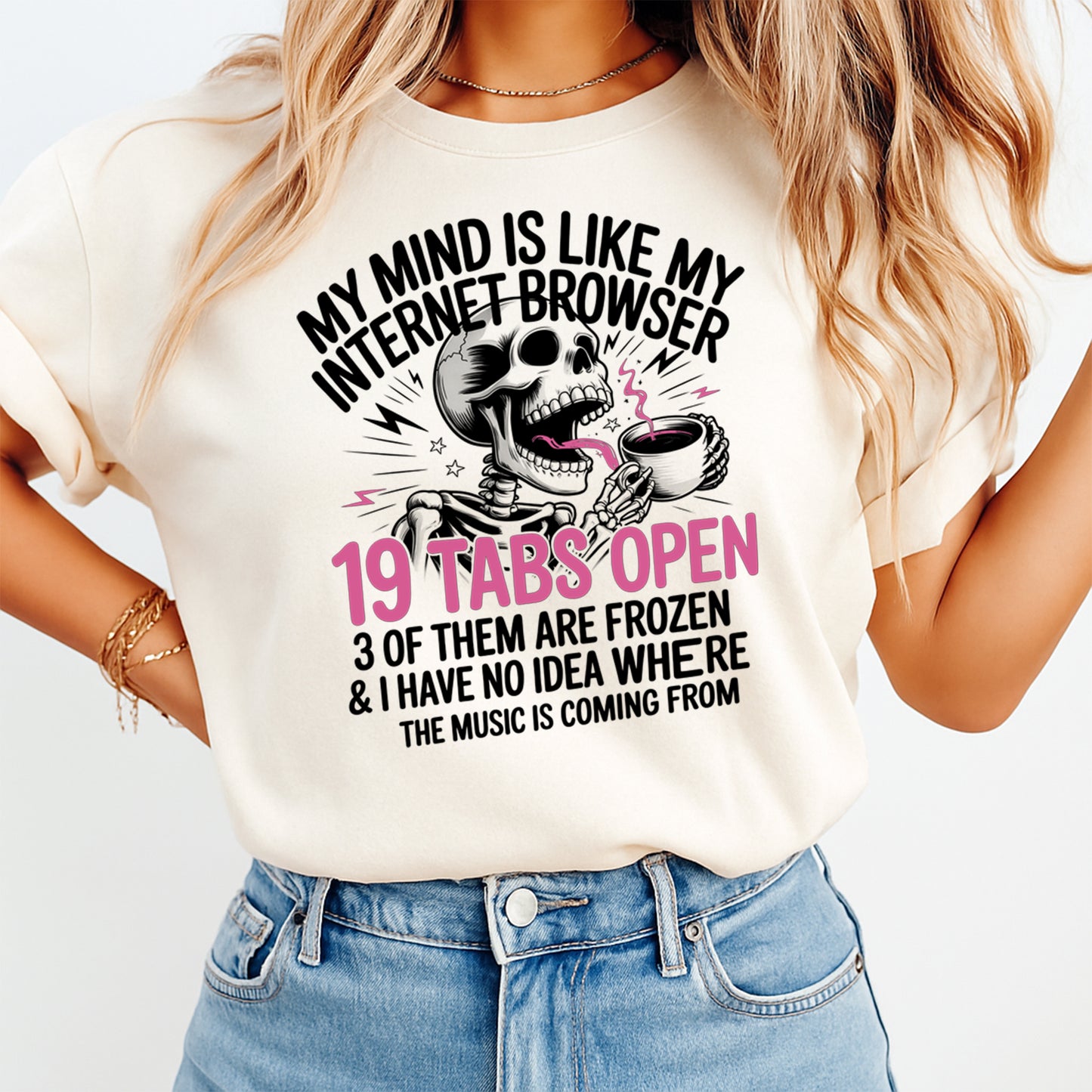 Woman wearing a cream shirt with a funny skeleton coffee graphic and sarcastic browser tabs quote, ready to press dtf mockup