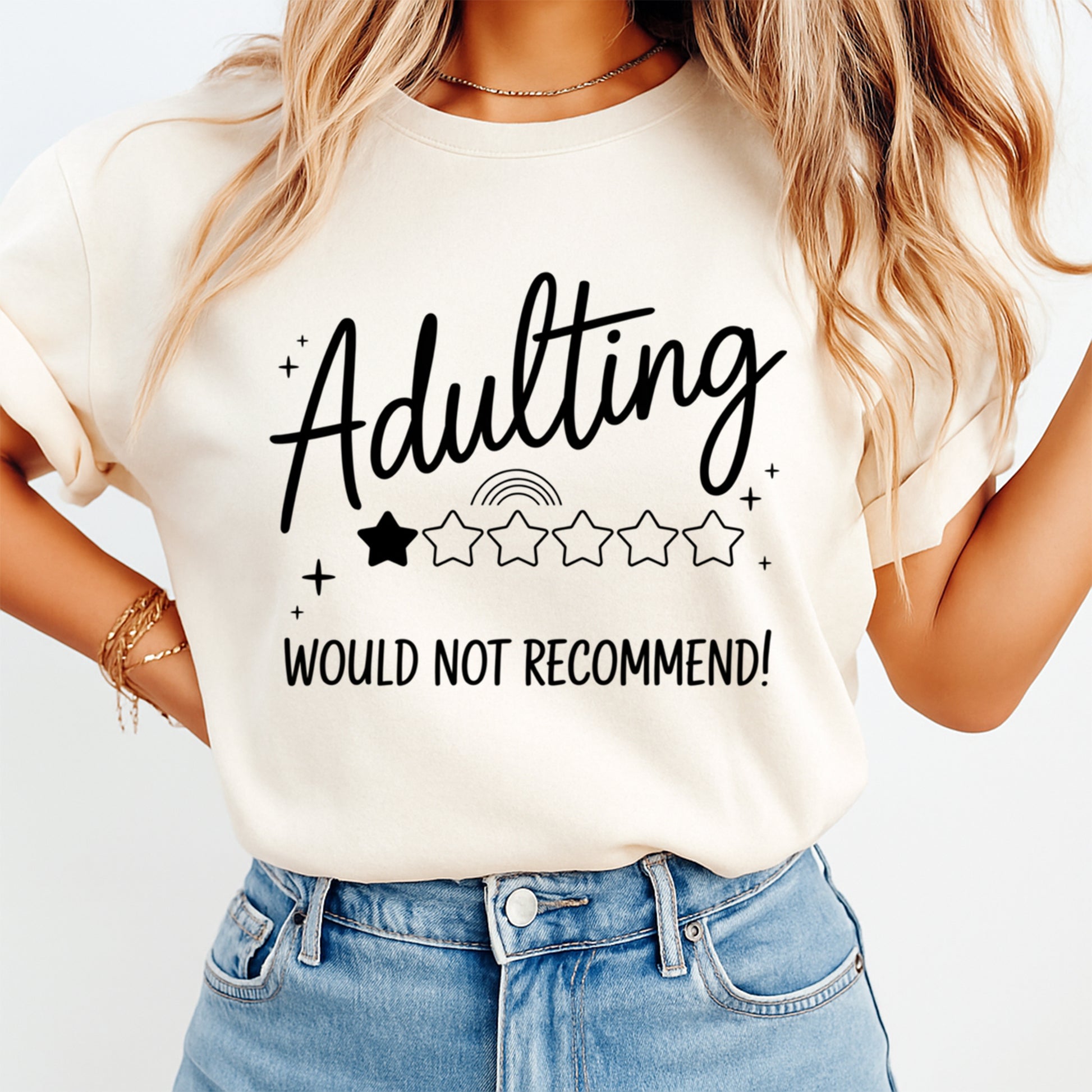 Woman wearing a cream shirt with adulting would not recommend quote and one star rating graphic, ready to press dtf mockup