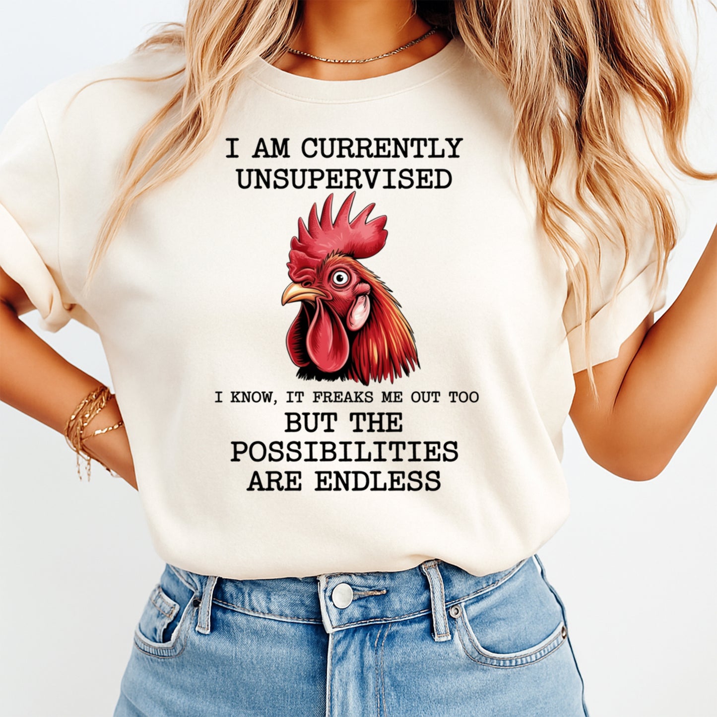 Woman wearing a cream shirt with a funny unsupervised rooster quote graphic, ready to press dtf mockup