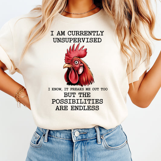 Woman wearing a cream shirt with a funny unsupervised rooster quote graphic, ready to press dtf mockup