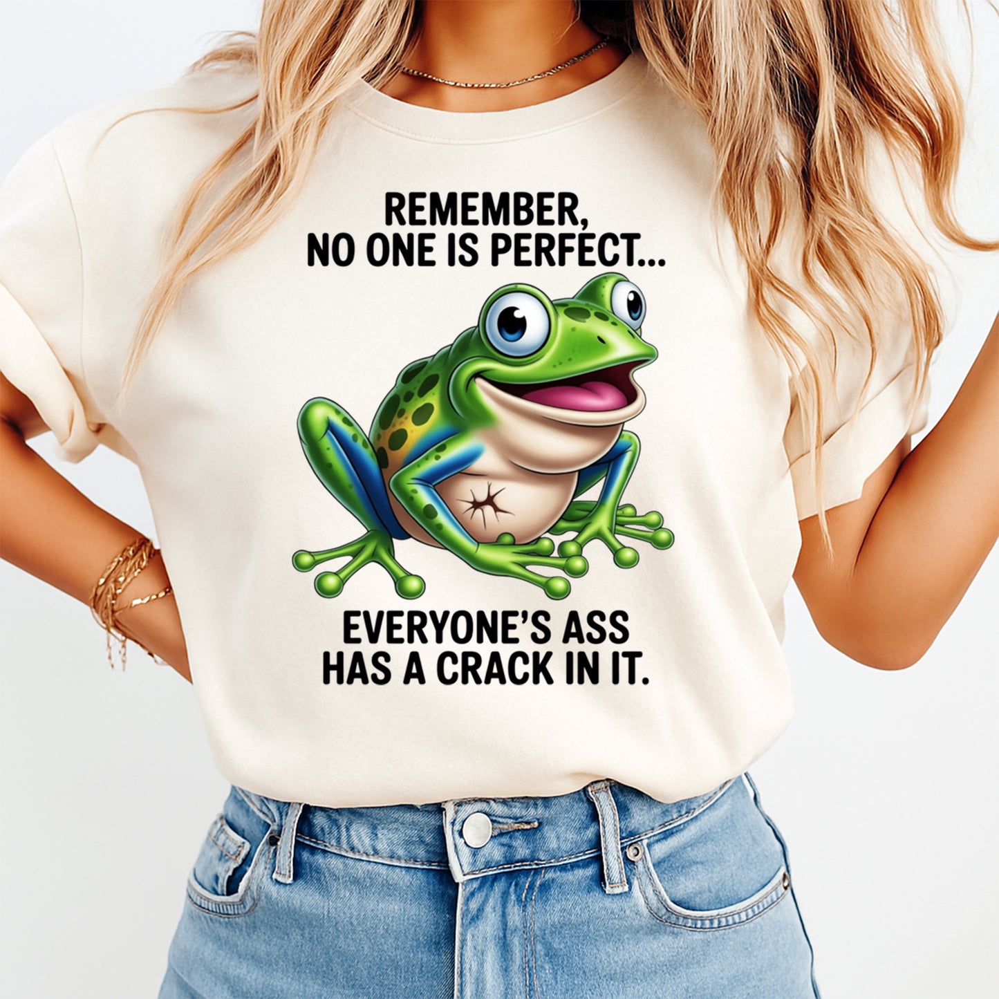 Mockup shirt featuring a bright green frog with the phrase Remember no one is perfect everyones ass has a crack in it
