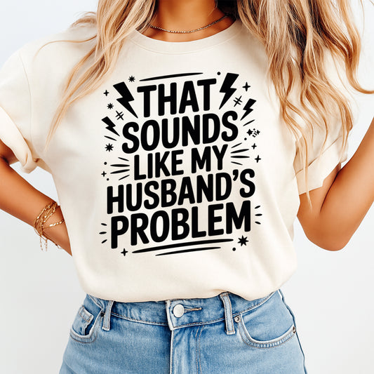 Mockup showing a bold sarcastic quote ready to press dtf transfer that says That Sounds Like My Husband’s Problem with lightning bolt accents