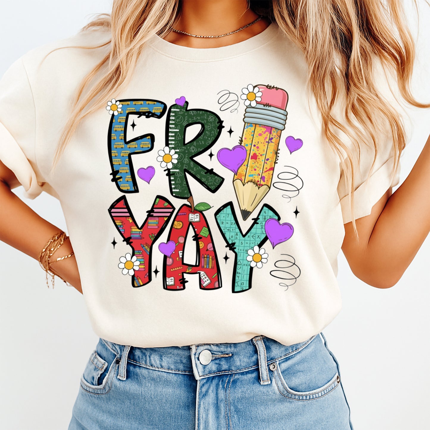 Mockup image of a cream shirt featuring the word Fri Yay in colorful school themed letters with a pencil, daisies, hearts, and classroom pattern details