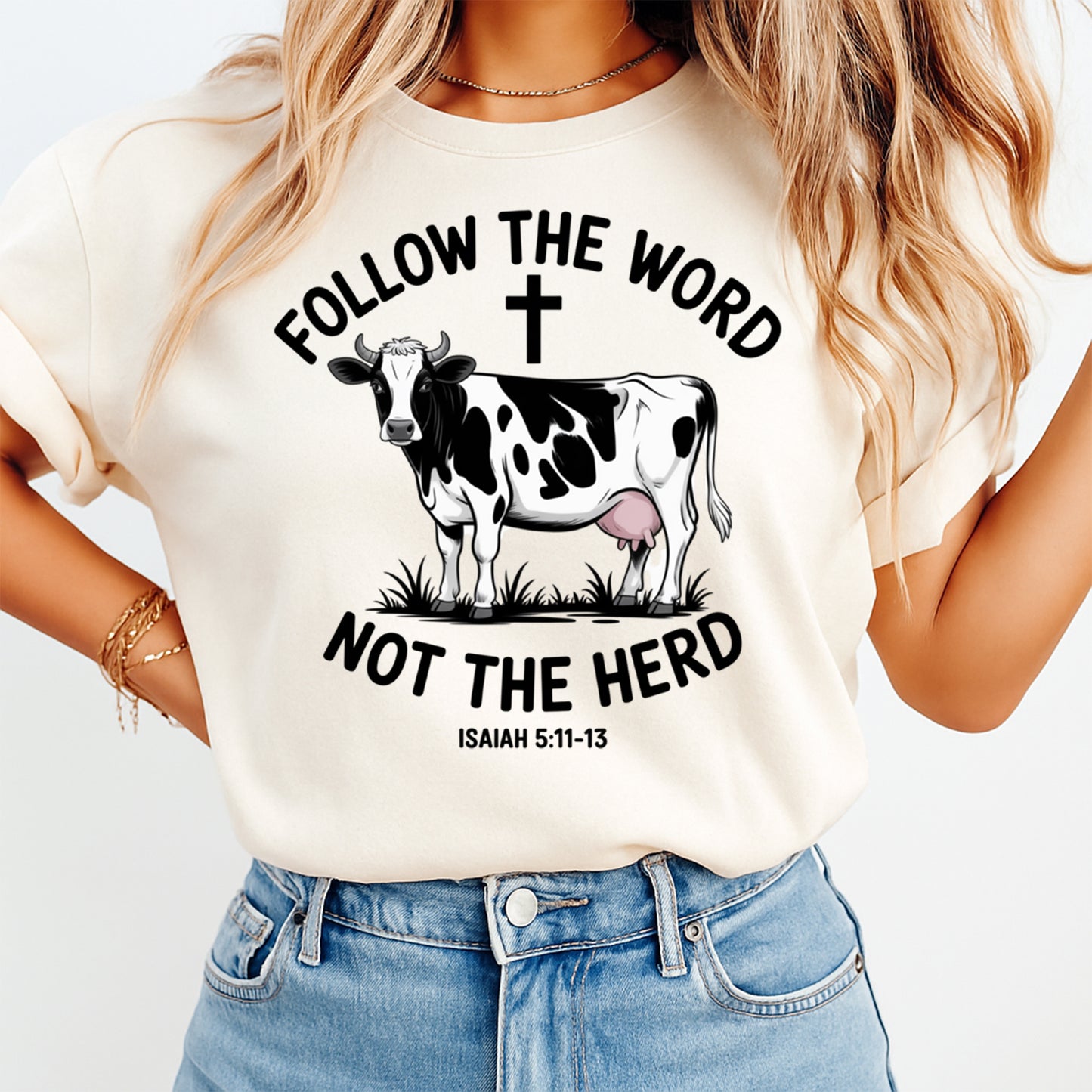 Mockup of Christian cow ready to press dtf transfer on a cream shirt featuring “Follow The Word Not The Herd” quote, cross, and cow graphic for DIY faith shirts.