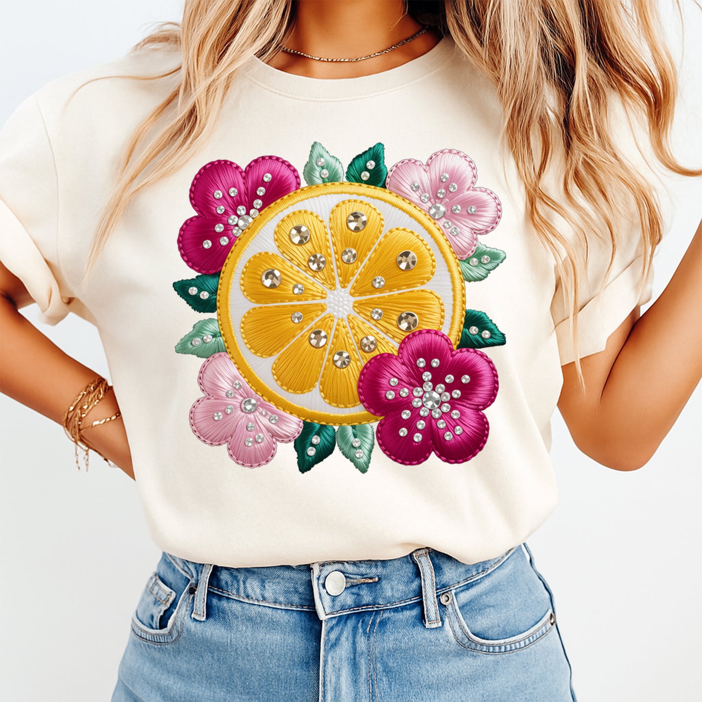 Mockup of a cream shirt featuring a summer lemon floral ready to press dtf transfer with citrus slice, pink flowers, green leaves, and rhinestone-style details.