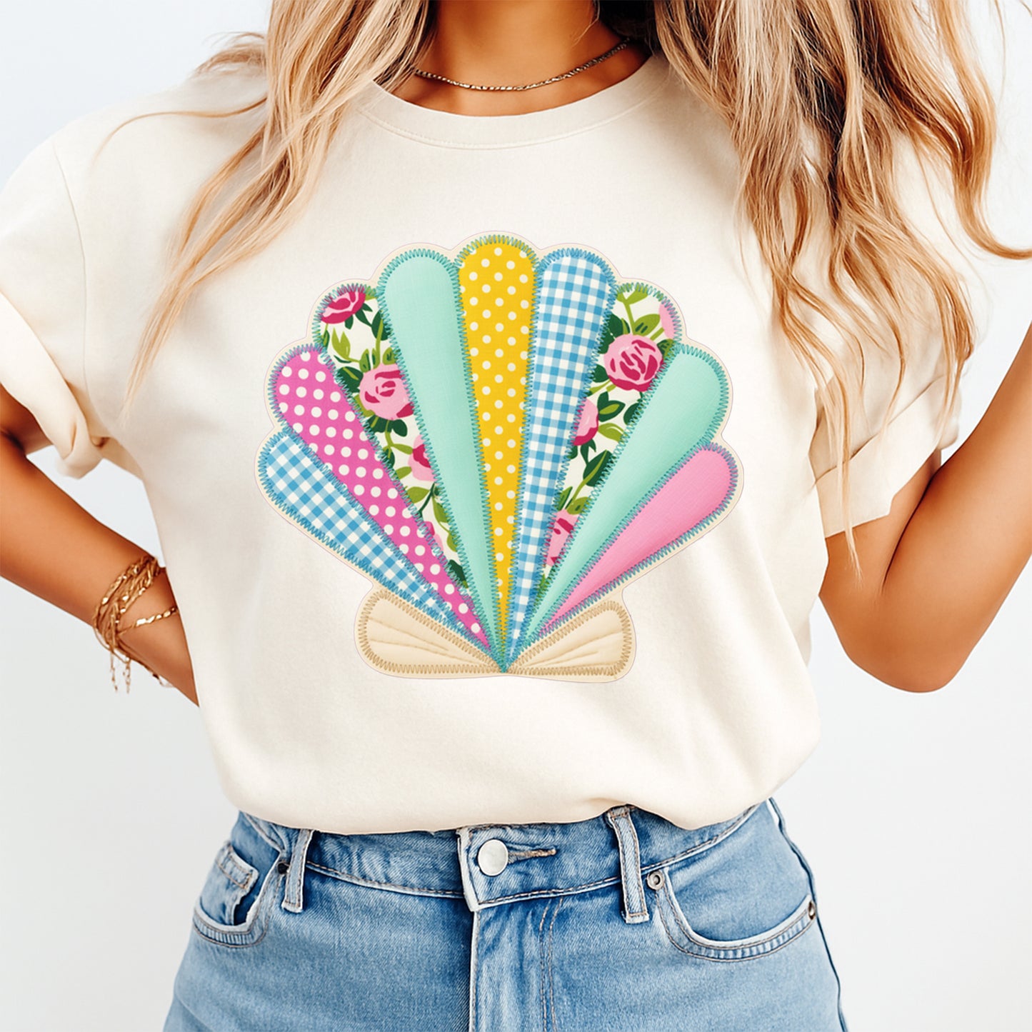 Mockup of a cream shirt featuring a summer seashell ready to press dtf transfer with pastel floral, polka dot, and gingham shell details.