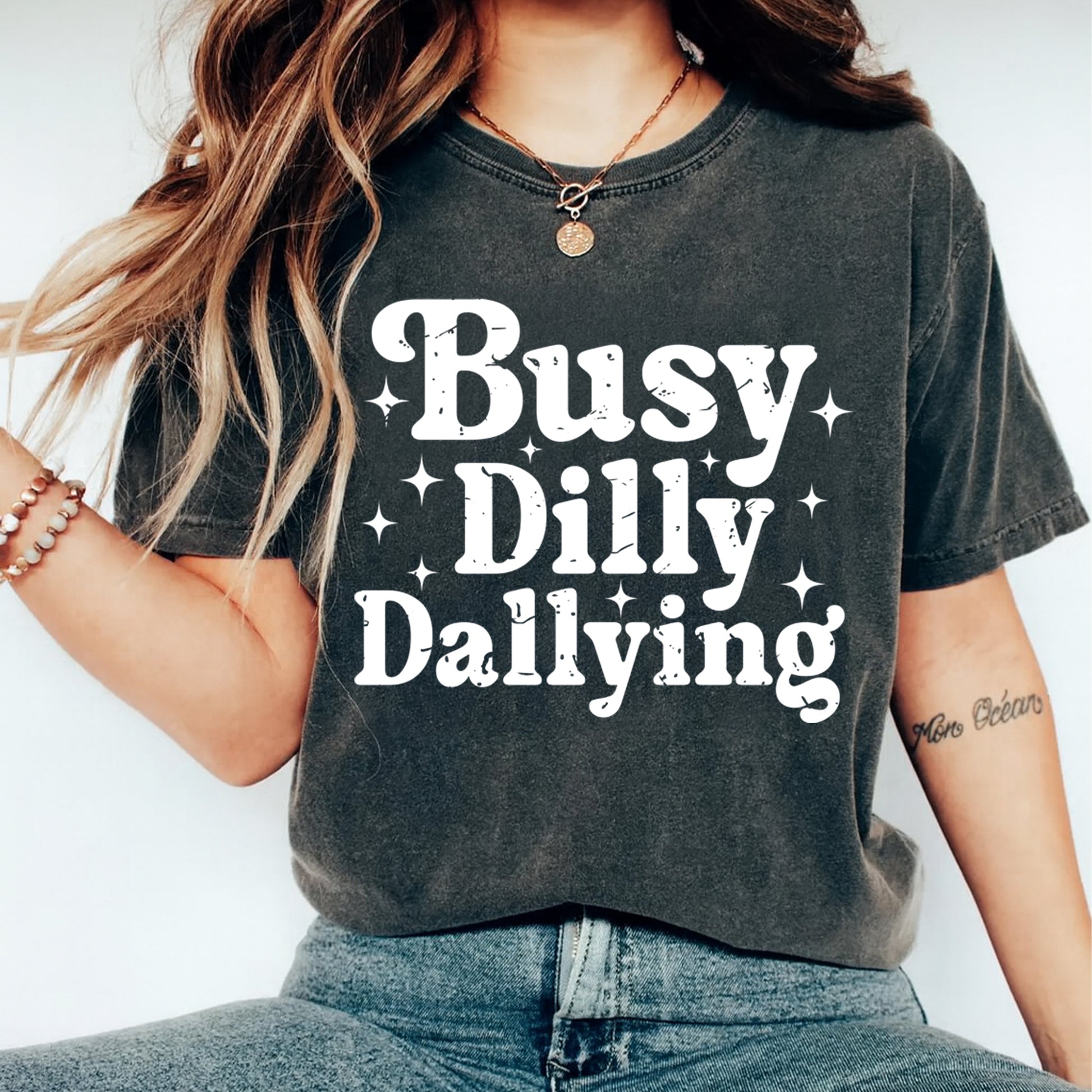 Funny shirt mockup featuring Busy Dilly Dallying ready to press dtf transfer on a dark gray casual tee