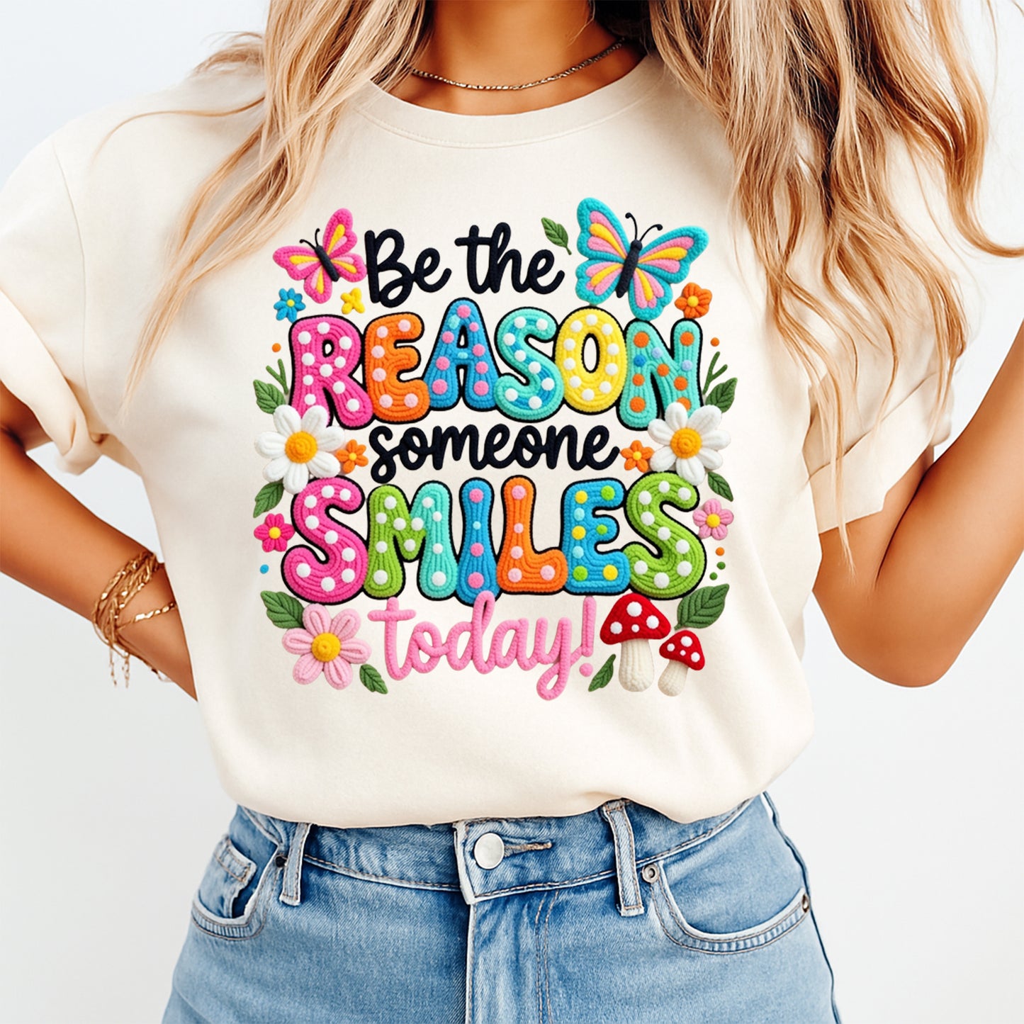 Cream shirt mockup featuring a colorful Be the Reason Someone Smiles Today ready to press dtf transfer with butterflies and flowers.