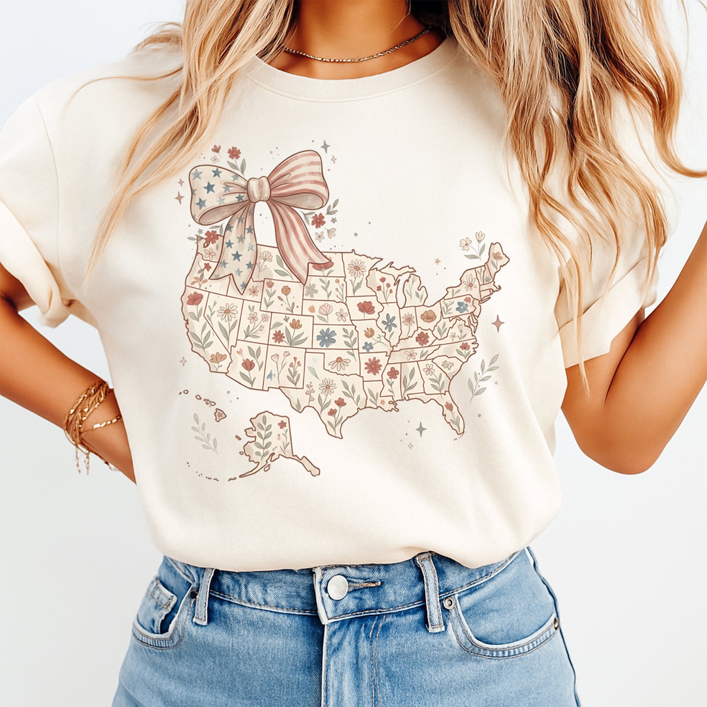 Mockup of a cream shirt featuring a patriotic USA map ready to press dtf transfer with pastel floral state details, stars, and a red white blue bow.
