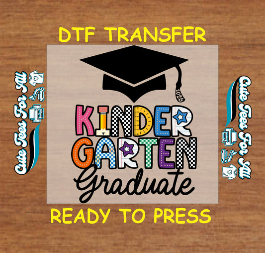 Kinder Garten Graduate 2026 ready to press dtf artwork with black graduation cap, 2026 tassel, colorful kindergarten letters, and script graduate text.