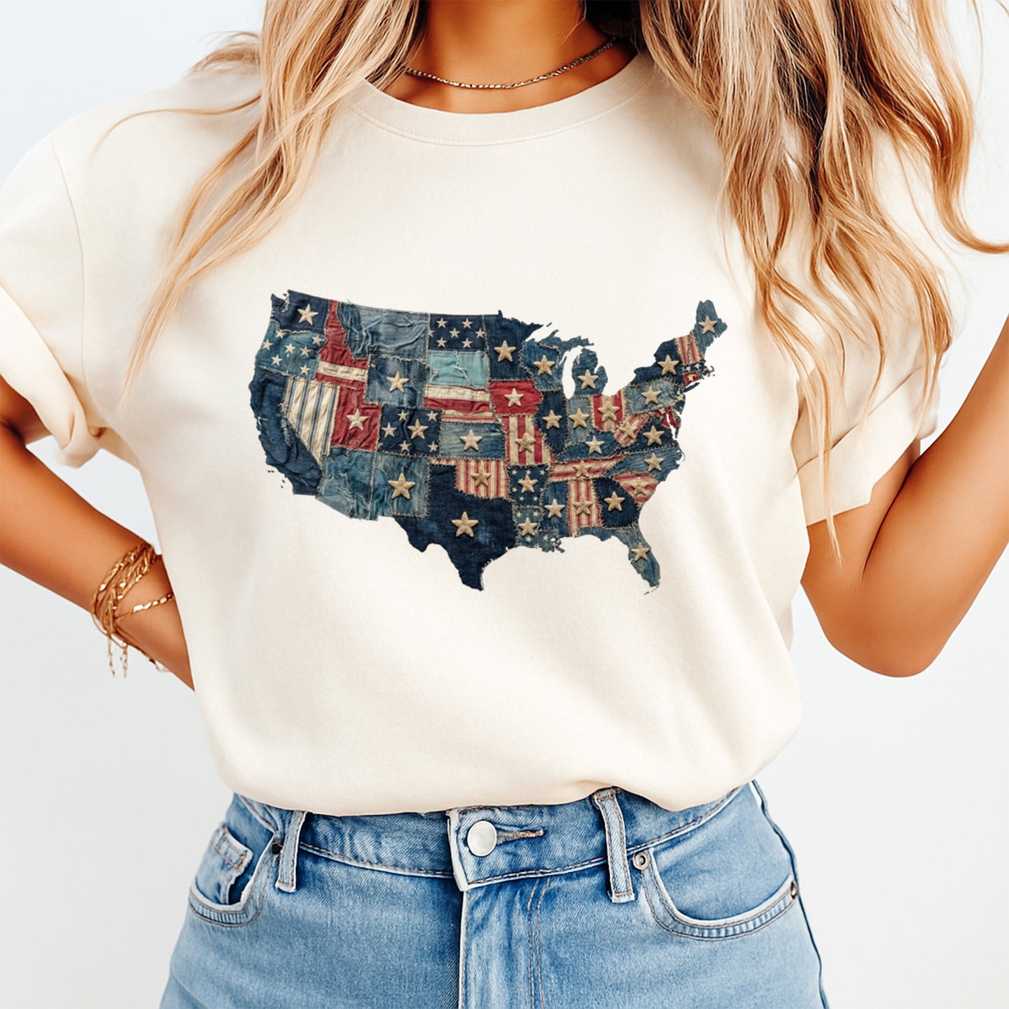 Person wearing a white t-shirt with a colorful USA map design.