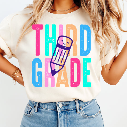 Person wearing a t-shirt with 'THIRD GRADE' and a pencil graphic on a white background