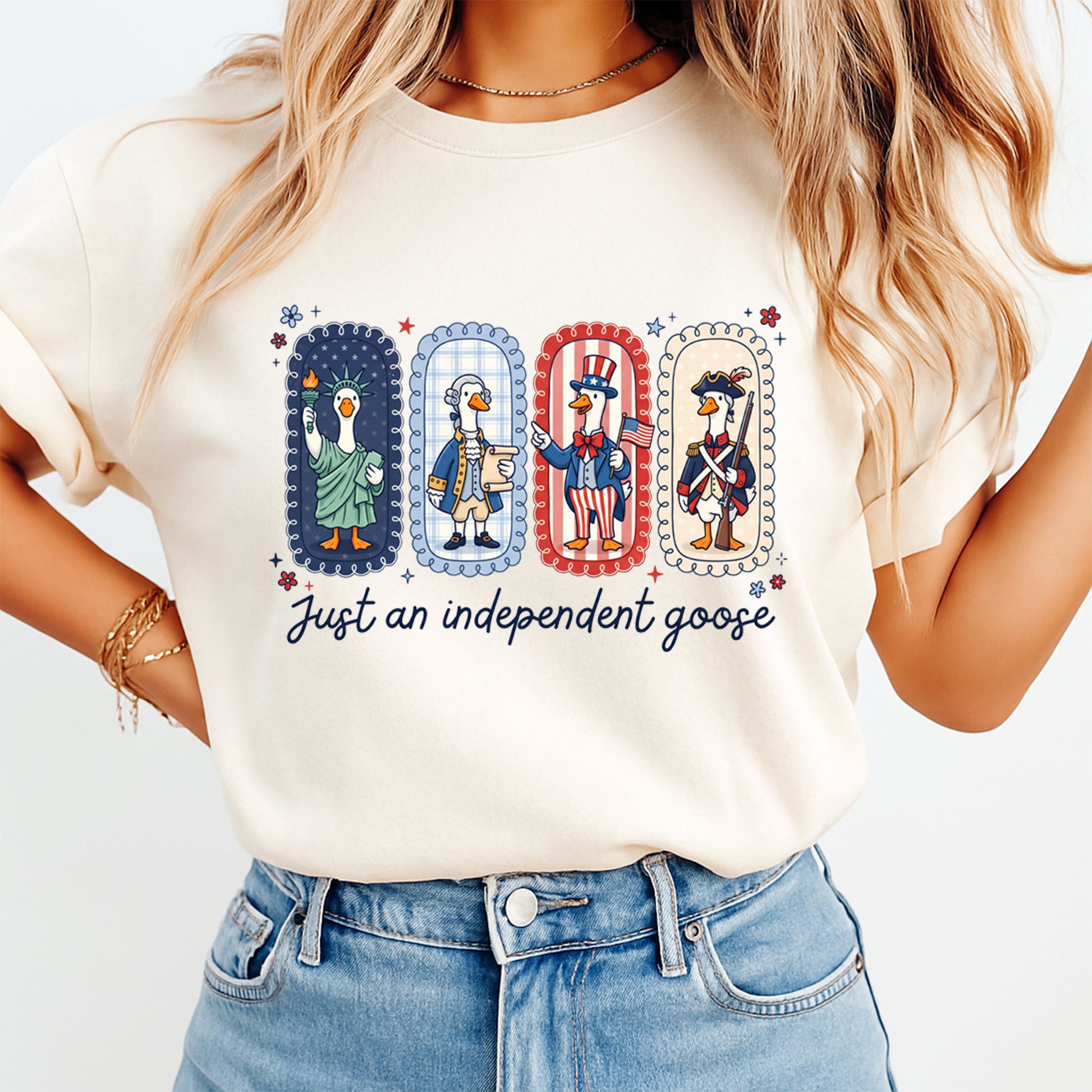 Person wearing a t-shirt with a graphic of four geese in patriotic outfits and the text 'Just an independent goose'.