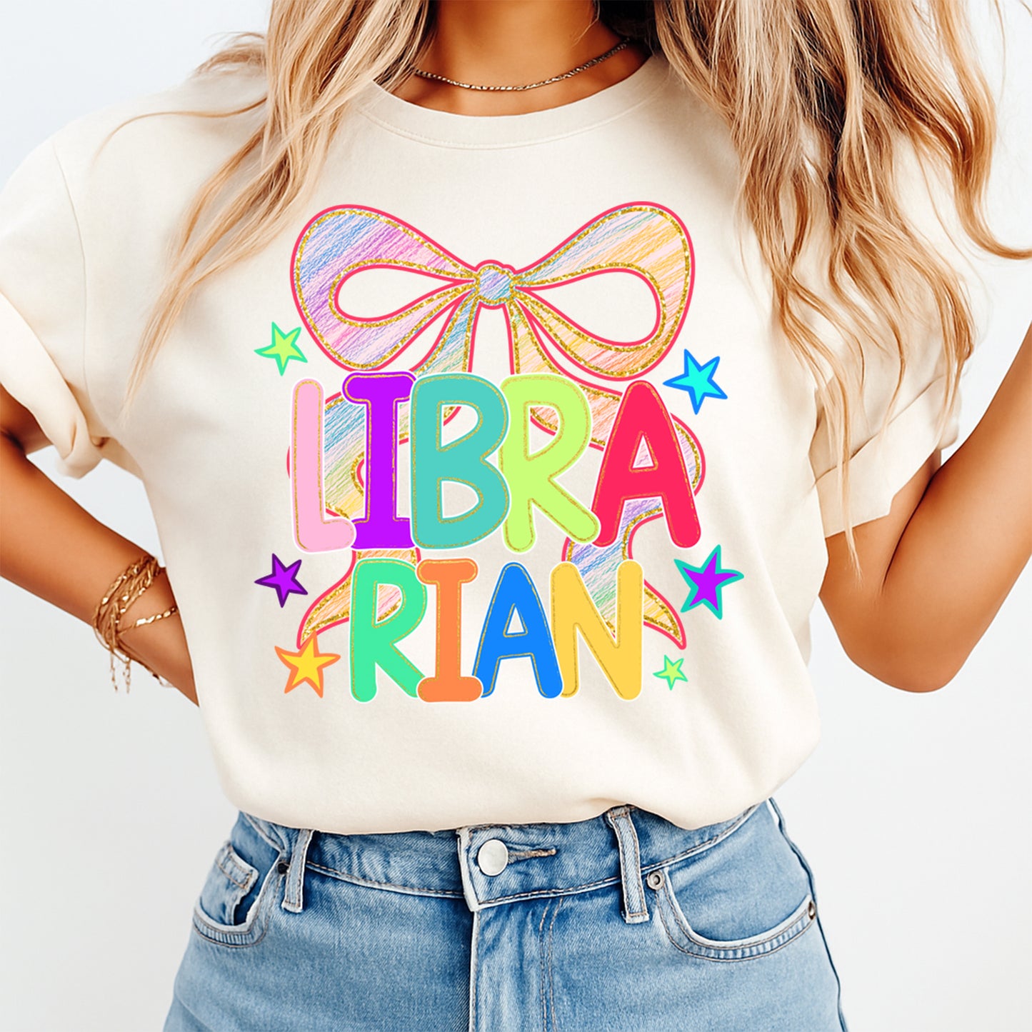 Librarian shirt mockup with colorful bow school library DTF transfer on cream T-shirt