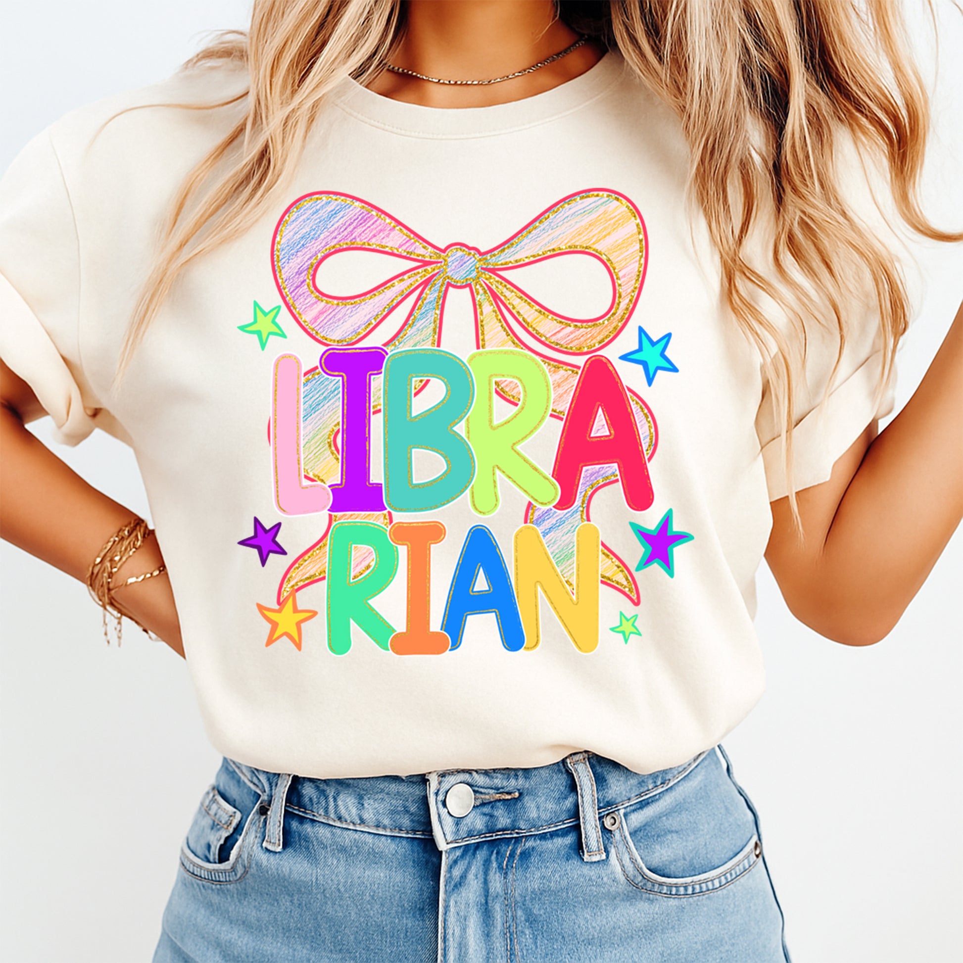 Librarian shirt mockup with colorful bow school library DTF transfer on cream T-shirt