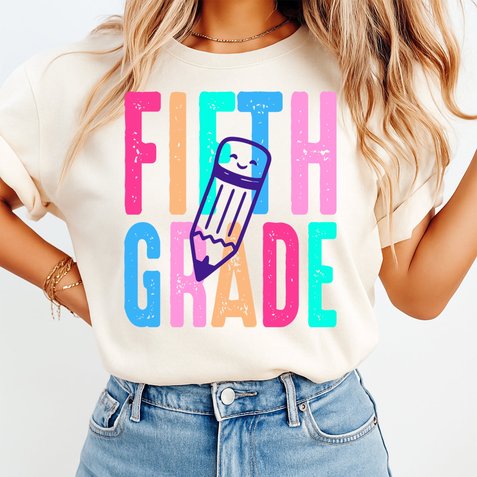 Person wearing a t-shirt with 'FIFTH GRADE' and a pencil graphic on a white background