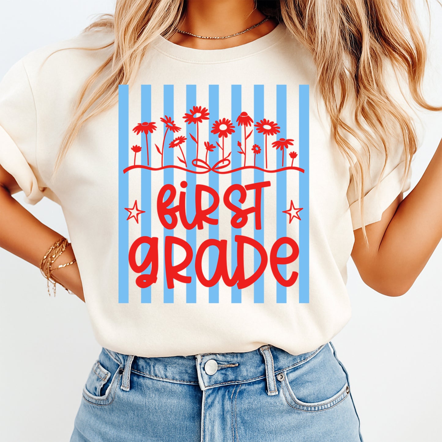 First Grade flowers DTF transfer mockup on cream shirt with red lettering, blue stripes, and classroom teacher design