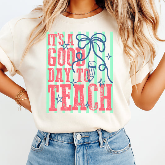 Teacher DTF transfer mockup on cream shirt with It’s a Good Day to Teach pencil bow design