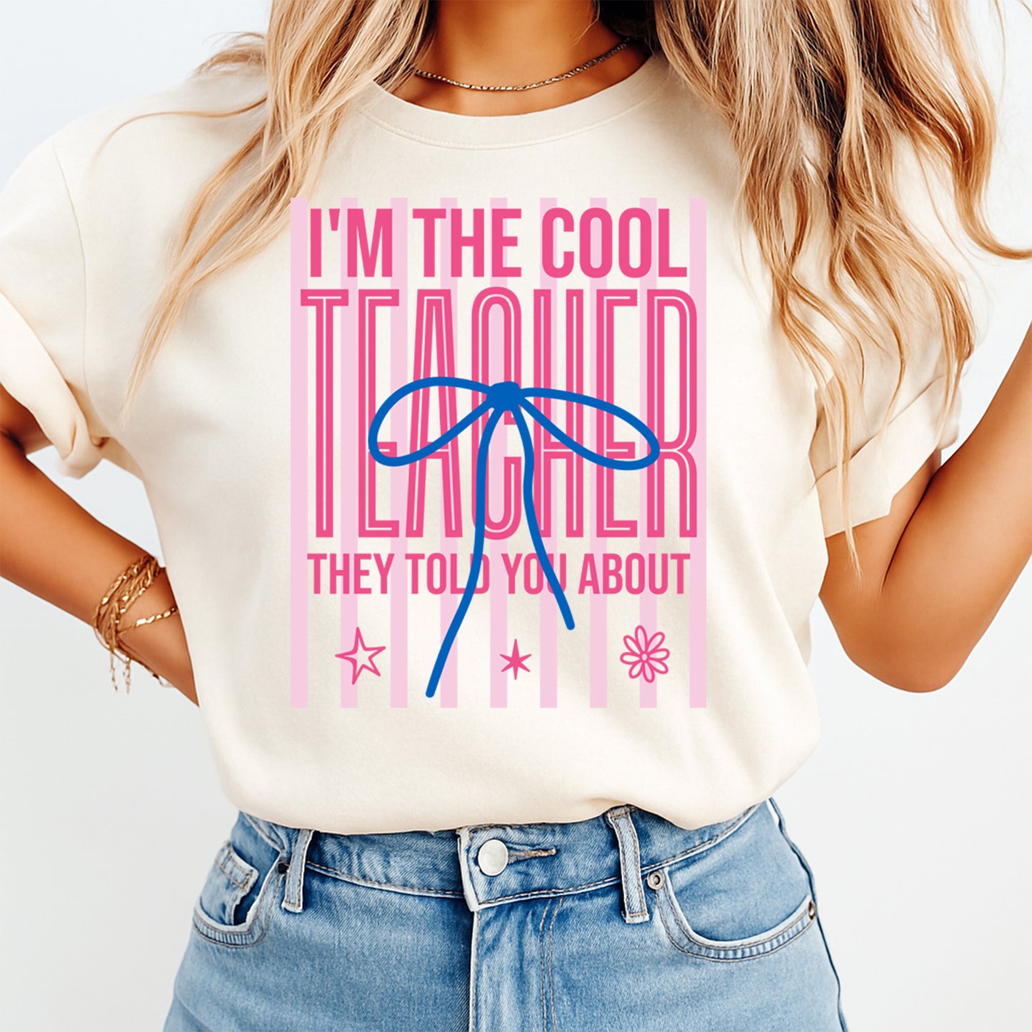 Teacher DTF transfer mockup on cream shirt with I’m the Cool Teacher pink bow design