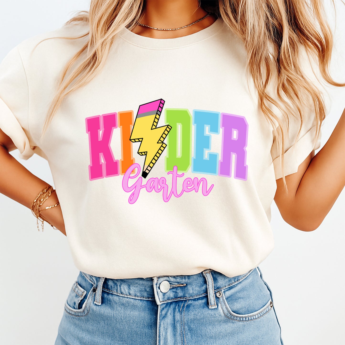Cream shirt mockup featuring colorful kindergarten pencil bolt ready to press DTF transfer for teacher shirts