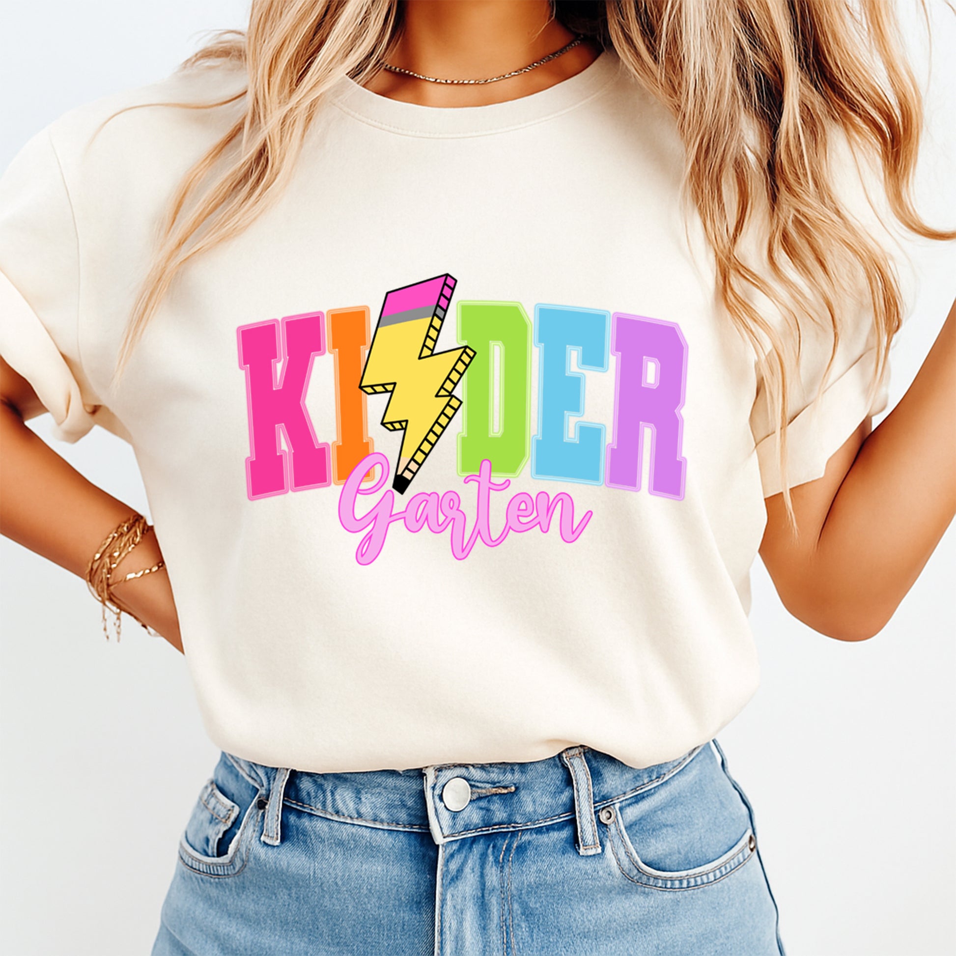 Cream shirt mockup featuring colorful kindergarten pencil bolt ready to press DTF transfer for teacher shirts