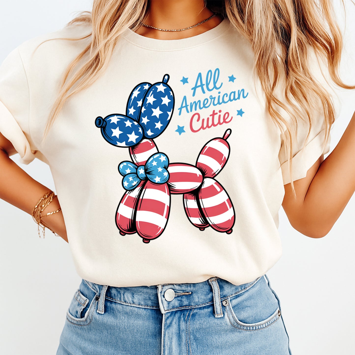 Person wearing a t-shirt with a patriotic balloon dog design and 'All American Cutie' text.