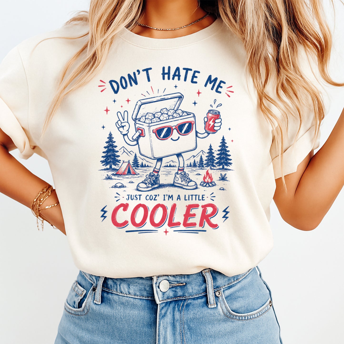 Person wearing a t-shirt with a graphic design of a cooler and text 'Don't Hate Me Just Coz' I'm a Little Cooler'.