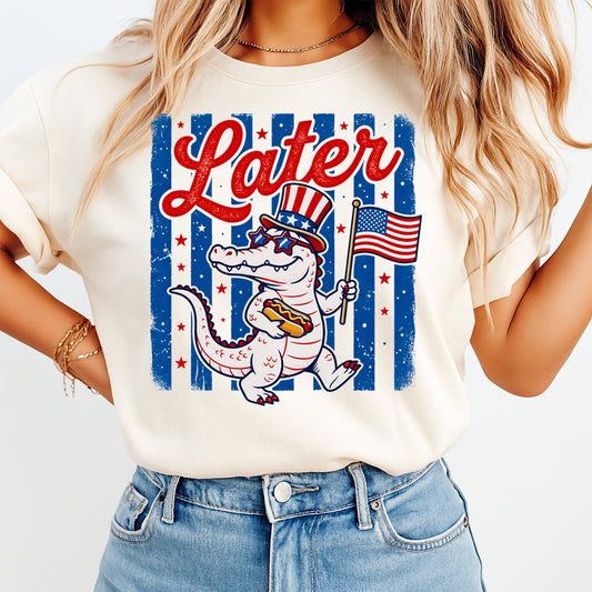 Woman wearing cream shirt with Fourth of July Later Gator DTF transfer featuring patriotic alligator and American flag